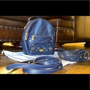 Beautiful MK mini backpack purse in Navy and gold. Guitar/crossbody straps incl.